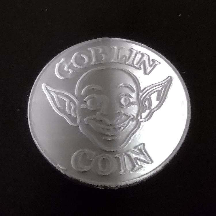 Goblin Coin front with smiling goblin face
